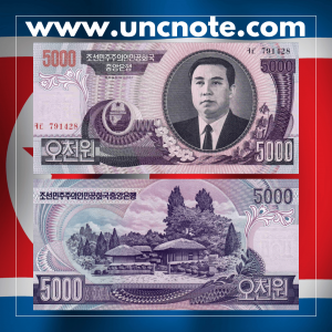 North Korea 5000 Won 2006 banknote, obverse with worker portrait; reverse with industrial and agricultural landscape.